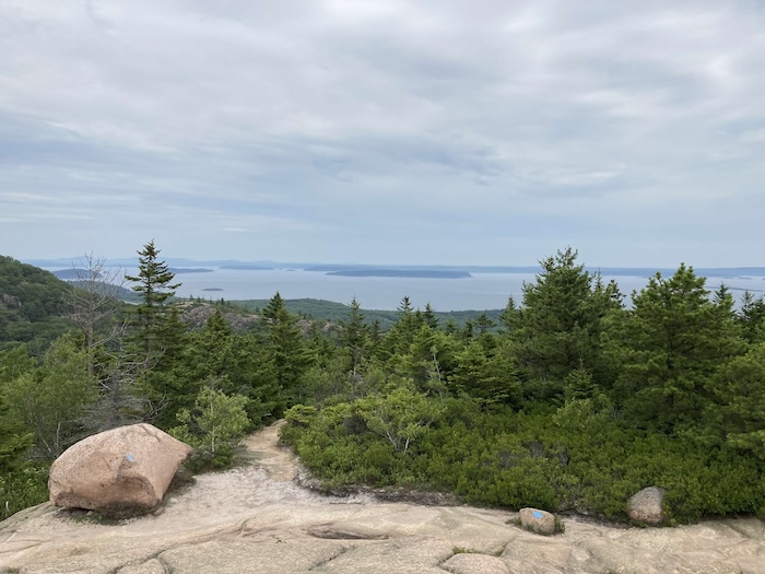 Scenic view of Acadia National Park's coastline and mountains from a hiking trail